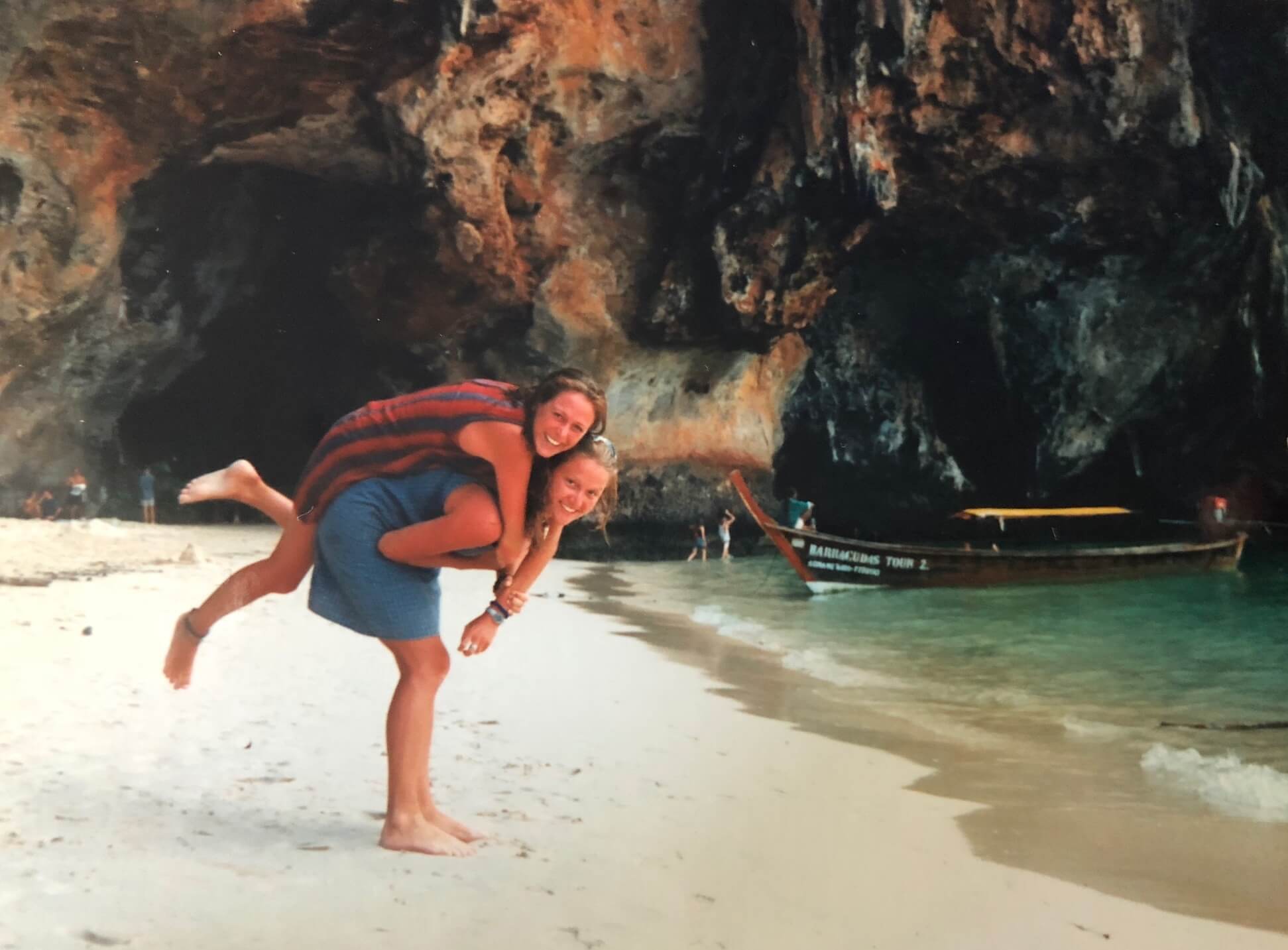 Friend giving another friend a piggy back